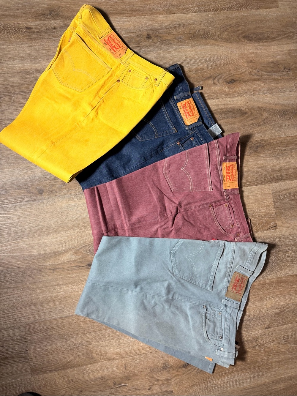 Levi's Men's jeans lot of 4 in Yellow, Navy, Burgundy, Light Gray. Size 42x32